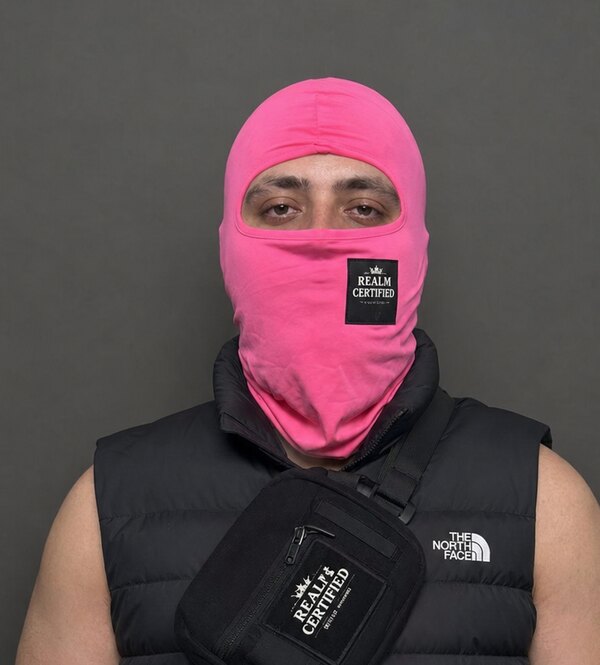 Operative Atauzi in a pink Realm Certified balaclava and North Face vest